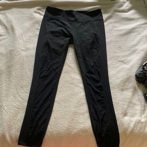 Fabletic black leggings with mesh on inside of calves.